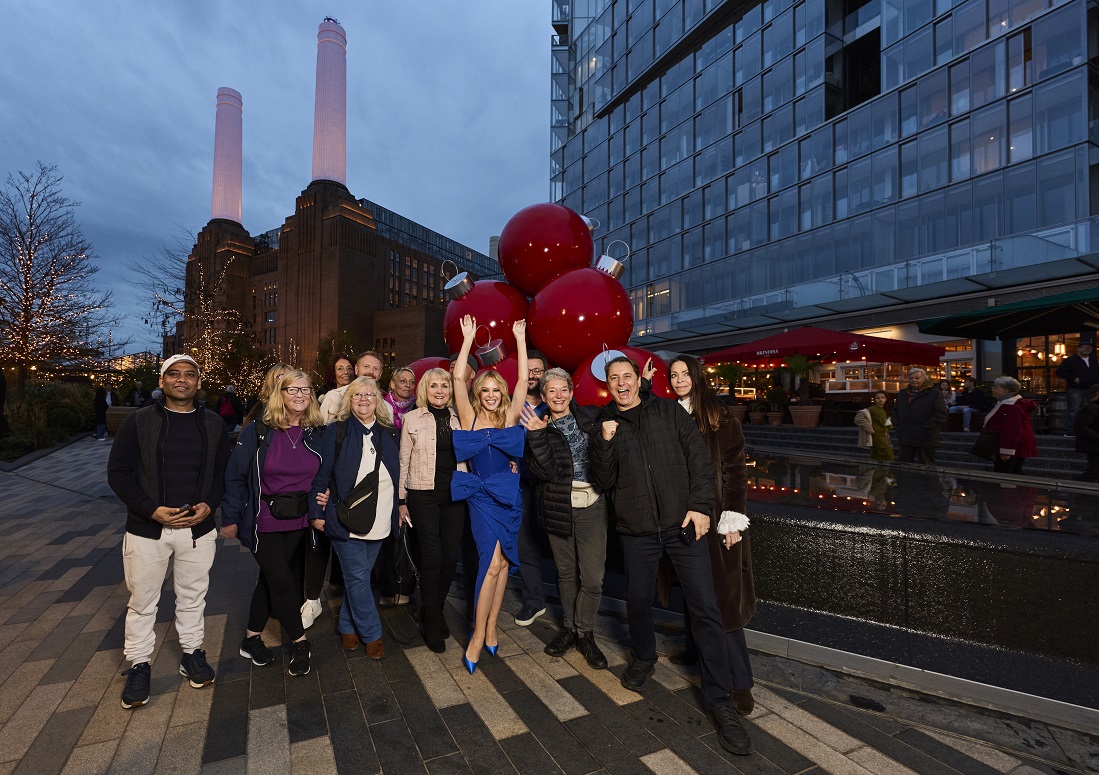 Kylie Minogue (in blue) with some of the visitors to Battersea Power Station’s Christmas Lights.