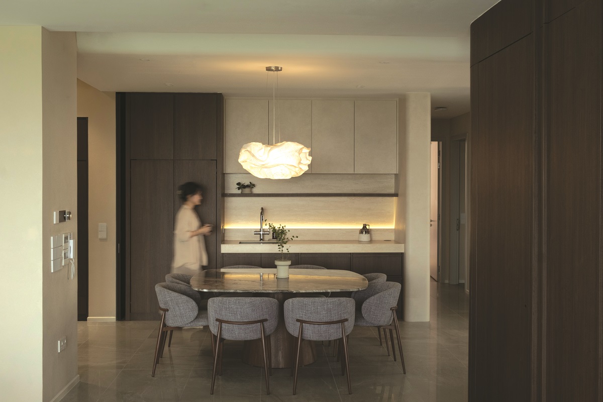 Dining room: A curved-square table anchors the space while accommodating eight people comfortably.