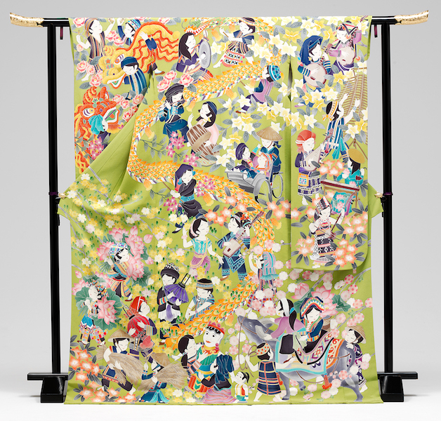 Vietnamese children of the 54 ethnic minorities in their national costumes take centre stage in this kimono, against a backdrop of soft green reflecting Vietnam’s rice cultivation culture, festival dragons and rickshaws.