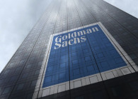 The Goldman Sachs Group logo on a skyscraper facade reflecting clouds. (Photo by 123rf)