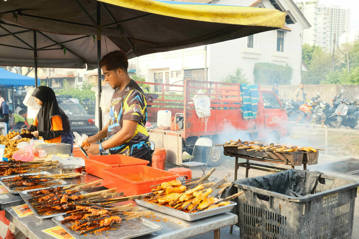 A bustling street food market in Malaysia